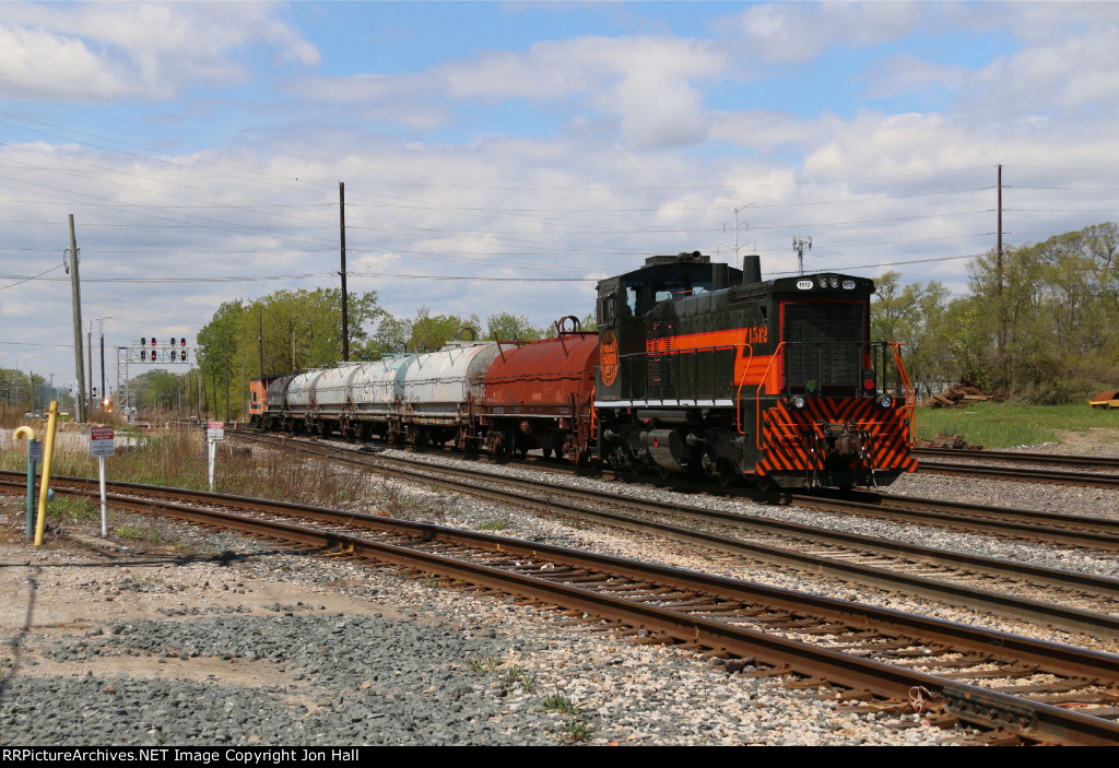 1512 shoves 6 coil cars and its caboose west